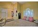 Inviting living room with high ceilings, a fireplace, and a large window at 7728 Whispering River St, Las Vegas, NV 89131