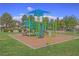 Colorful community playground with slides, climbing structures, and safe surfacing for active play and recreation at 7728 Whispering River St, Las Vegas, NV 89131