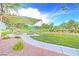 Community playground with covered picnic tables and play equipment, offering a fun and safe space for children at 7728 Whispering River St, Las Vegas, NV 89131