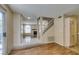 Open entryway with tile floors, stairs, and access to the living room featuring a fireplace at 7732 Almeria Ave, Las Vegas, NV 89128