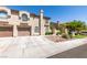 Inviting townhome with a two-car garage and desert landscaping for low maintenance appeal at 7732 Almeria Ave, Las Vegas, NV 89128