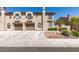 Inviting townhome with a two-car garage and desert landscaping for low maintenance appeal at 7732 Almeria Ave, Las Vegas, NV 89128