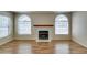 Cozy living room featuring a fireplace and arched windows at 7732 Almeria Ave, Las Vegas, NV 89128