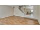 Bright living room with wood floors and staircase access at 7732 Almeria Ave, Las Vegas, NV 89128