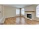 Spacious living room featuring a fireplace and plenty of light at 7732 Almeria Ave, Las Vegas, NV 89128