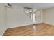 Spacious living room with a staircase and neutral walls at 7732 Almeria Ave, Las Vegas, NV 89128