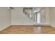 Bright living room featuring wood floors and staircase at 7732 Almeria Ave, Las Vegas, NV 89128