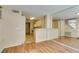 Open concept living area with access to kitchen and staircase at 7732 Almeria Ave, Las Vegas, NV 89128