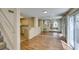 Open living area showcases wood floors, staircase, and kitchen view at 7732 Almeria Ave, Las Vegas, NV 89128