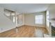 Open living room with wood floors, fireplace, and natural light at 7732 Almeria Ave, Las Vegas, NV 89128