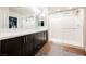 Modern bathroom features double vanity, walk-in shower, and patterned tile floors at 8113 Misty Canyon Ave, Las Vegas, NV 89113