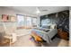 Cozy bedroom with a unique hanging chair and a tropical themed accent wall at 8113 Misty Canyon Ave, Las Vegas, NV 89113
