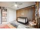 Well-appointed Bedroom featuring wood slat accent wall and a modern crib at 8113 Misty Canyon Ave, Las Vegas, NV 89113