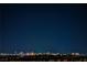 A night view of the cityscape from a rooftop, featuring bright lights and distant buildings at 8113 Misty Canyon Ave, Las Vegas, NV 89113