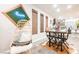 Dining area with a dining table, decorative wall art and access to kitchen and living spaces at 8113 Misty Canyon Ave, Las Vegas, NV 89113