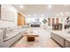 Spacious living room area with an open floor plan including a dining area and stylish furnishings at 8113 Misty Canyon Ave, Las Vegas, NV 89113