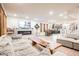 Large living room with an open floor plan, modern fireplace, and comfortable seating at 8113 Misty Canyon Ave, Las Vegas, NV 89113