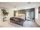 Comfortable bedroom with modern furnishings, decorative wall, and a ceiling fan at 8113 Misty Canyon Ave, Las Vegas, NV 89113