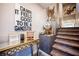 Stylish staircase with unique decor and statement wall art, enhancing the home's modern aesthetic at 8113 Misty Canyon Ave, Las Vegas, NV 89113