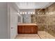 A primary bathroom with dual vanities and a large glass-enclosed shower at 8409 Insignia Ave # 102, Las Vegas, NV 89178