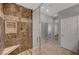 Bathroom featuring a glass enclosed shower, tile floor, and neutral color palette at 8409 Insignia Ave # 102, Las Vegas, NV 89178