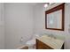 A powder room features a wood-framed mirror and modern sink at 8409 Insignia Ave # 102, Las Vegas, NV 89178