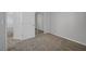 Bedroom showcasing neutral walls, carpet, mirrored closet, and white door at 8409 Insignia Ave # 102, Las Vegas, NV 89178