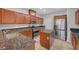 Well-lit kitchen featuring granite countertops, stainless steel appliances, and a kitchen island at 8409 Insignia Ave # 102, Las Vegas, NV 89178