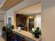Community kitchen area with bar seating, stainless steel appliances, and sleek cabinets at 8409 Insignia Ave # 102, Las Vegas, NV 89178
