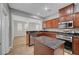 Modern kitchen showcases a center island, stainless steel appliances, and plenty of storage at 8409 Insignia Ave # 102, Las Vegas, NV 89178