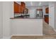 Features wood cabinets, stainless steel appliances, and stone countertops at 8409 Insignia Ave # 102, Las Vegas, NV 89178
