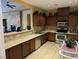Community kitchen area featuring stainless appliances, bar seating, and ample counter space at 8409 Insignia Ave # 102, Las Vegas, NV 89178