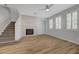 Spacious living room featuring beautiful flooring, a cozy fireplace, and natural light at 8409 Insignia Ave # 102, Las Vegas, NV 89178