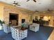 Community lounge with a stone fireplace, comfortable seating, and a small bar area at 8409 Insignia Ave # 102, Las Vegas, NV 89178