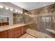 The primary bathroom showcases a glass-enclosed shower, dual sinks, and modern lighting at 8409 Insignia Ave # 102, Las Vegas, NV 89178