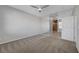The primary bedroom boasts neutral tones and a mirrored wall, creating an open and inviting atmosphere at 8409 Insignia Ave # 102, Las Vegas, NV 89178