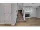 A carpeted staircase leads to the upper level, complementing the modern decor and inviting ambiance of the home at 8409 Insignia Ave # 102, Las Vegas, NV 89178