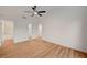 This spacious bedroom has wood-look flooring with access to a closet and a bathroom at 8412 Mulcahy Ave, Las Vegas, NV 89145