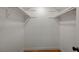 Walk-in closet with shelving and wood-look flooring; ideal storage for your wardrobe at 8412 Mulcahy Ave, Las Vegas, NV 89145