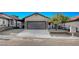Charming home with a two-car garage, low maintenance landscaping, and a tidy yard at 8412 Mulcahy Ave, Las Vegas, NV 89145