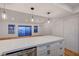 Open kitchen with quartz counters and luxury vinyl plank, flowing seamlessly into the dining area at 8412 Mulcahy Ave, Las Vegas, NV 89145