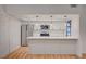 Contemporary kitchen with stainless steel appliances, white cabinets, stylish pendant lights, and quartz counters at 8412 Mulcahy Ave, Las Vegas, NV 89145
