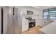 Bright kitchen features stainless steel appliances, white cabinetry, and durable countertops at 8412 Mulcahy Ave, Las Vegas, NV 89145