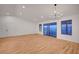 Spacious living room with luxury vinyl plank flooring, a modern chandelier, and plenty of natural light at 8412 Mulcahy Ave, Las Vegas, NV 89145