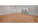 Open-concept living space with modern lighting and kitchen view at 8412 Mulcahy Ave, Las Vegas, NV 89145