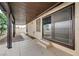 Covered patio with concrete floor, steps leading to the house, and view of the backyard at 8412 Mulcahy Ave, Las Vegas, NV 89145