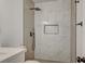 Stylish bathroom shower with modern fixtures and marble-look tiling at 8412 Mulcahy Ave, Las Vegas, NV 89145