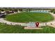 Community park featuring a large grassy area with benches and walking paths at 87 Serene Tempo Ave, Henderson, NV 89011