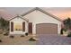 Charming single-story home with a two-car garage and neatly landscaped front yard at 87 Serene Tempo Ave, Henderson, NV 89011