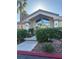 Attractive community clubhouse featuring a stone walkway and lush landscaping at 8805 Jeffreys St # 1112, Las Vegas, NV 89123